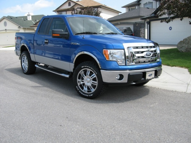  pictures of their 2009 Blue flame F150 with aftermarket lift or rims