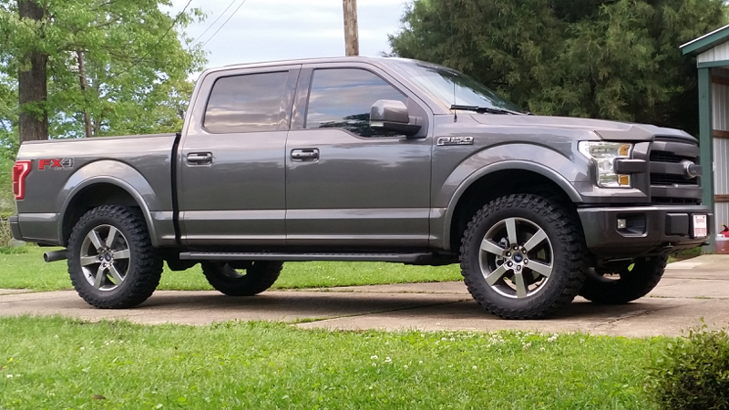 Show me your Leveled trucks with OEM rims! 