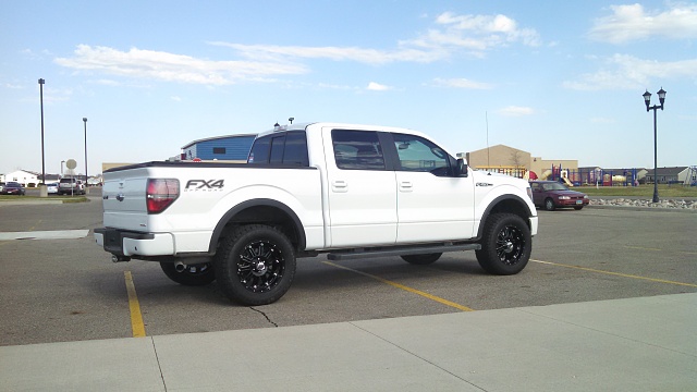 2009-2014 w/2in level and 33s-post-tires-wheels-1.jpg