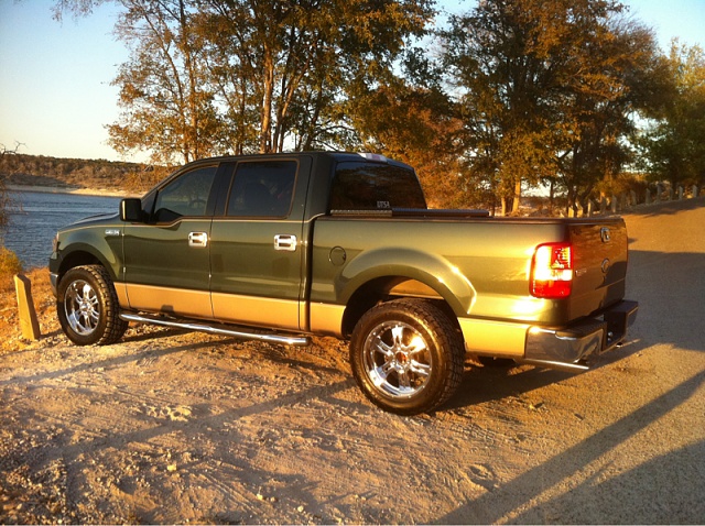 What color wheels on green truck.-image-469850210.jpg