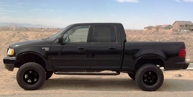 Murdered out/blacked out trucks... Post them-black-wheels.jpg